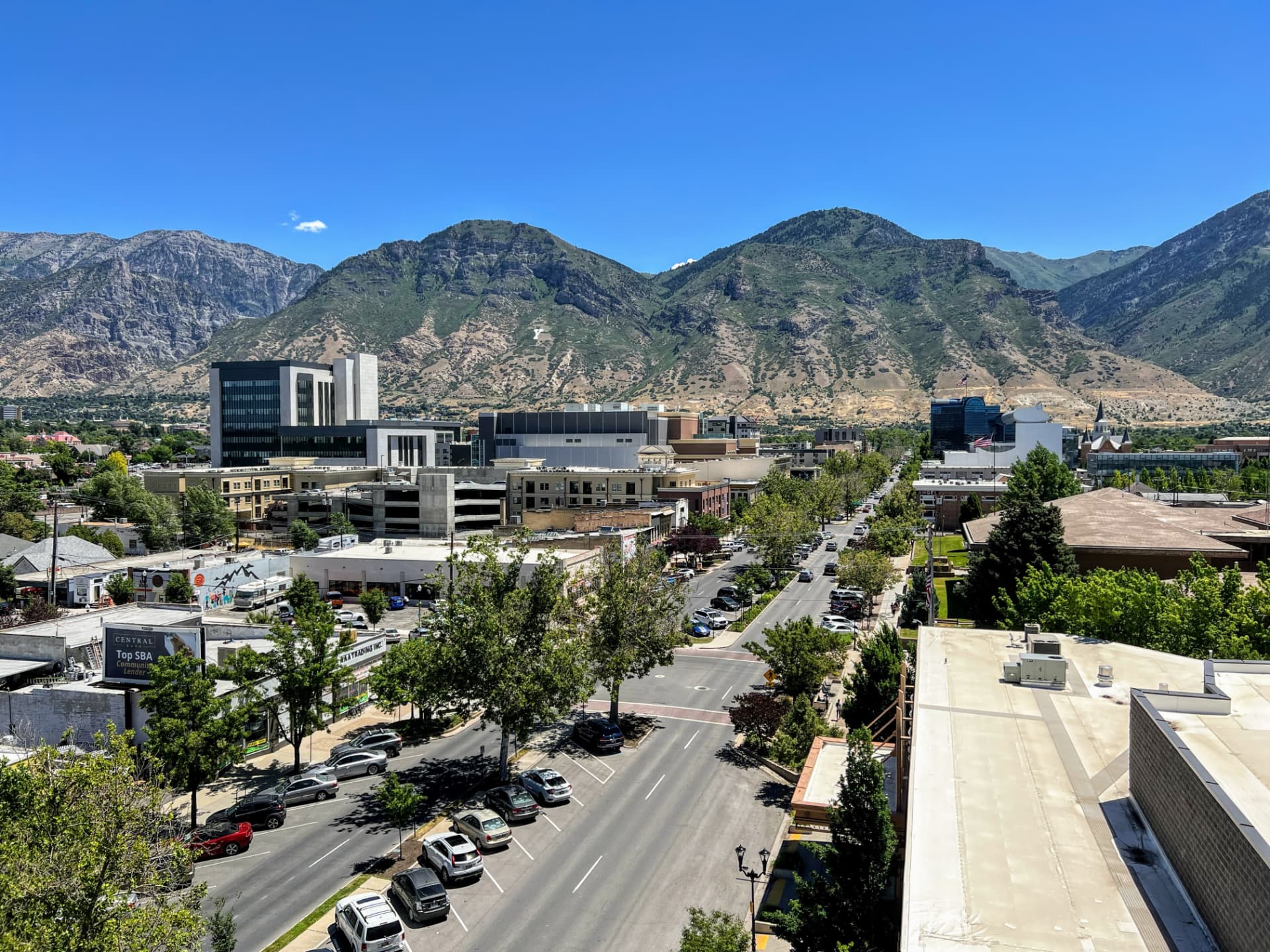 Aerial view of Provo, Utah streets and downtown with mountains in the distance