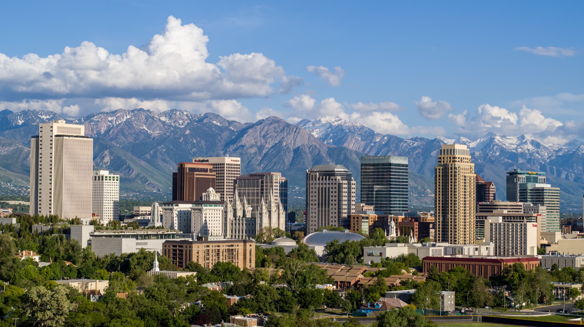 Salt Lake City skyline with the Wasatch Range and Temple in view on a bright day