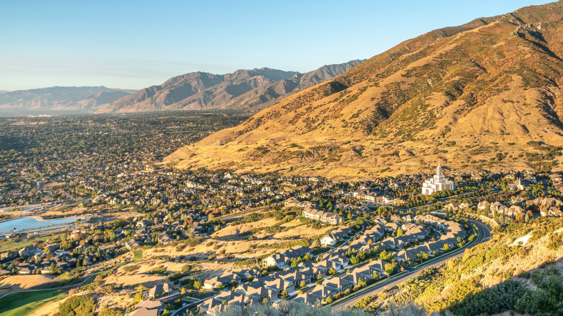 Aerial view of Draper, Utah neighborhoods nestled against the foothills with the temple visible
